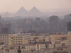 ZO, WS, Giza cityscape with pyramids in background, Egypt Stock Footage