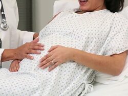 CU PAN Doctor Coaching Pregnant Woman Through Labor Pains / Richmond, Virginia, USA Stock Footage