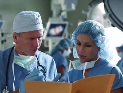MS Surgeons looking over chart in operating room / Edmonds, Washington, USA Stock Footage