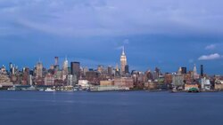 Manhattan, Dusk view of the Empire State Building and Midtown Manhattan across the Hudson River, New York, United States of America - Time lapse Stock Footage