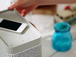 CU Hand placing cell phone on speaker and taking away both / Seoul, South Korea Stock Footage