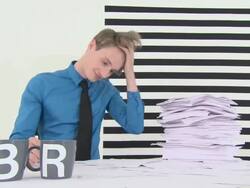 Person brings mugs that read break to busy office worker Stock Footage