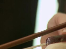 CU cellist puts rosin on his bow / Berlin, Germany Stock Footage