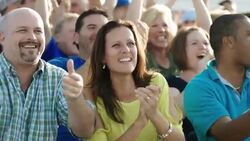 Spectators cheer at a sporting event. Stock Footage