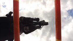 HD Super Slow-Mo: Show Hunter Jumping Over Camera Stock Footage