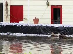May 9, 2011 Mississippi River Flooding sandbags deployed to protect home in  Memphis, Tennessee, USA Stock Footage