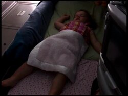 Baby / Toddler Asleep in First Class Seat Stock Footage