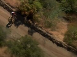 Aerial TS HA of mountain bike cyclist / Topanga State Canyon, California, United States Stock Footage