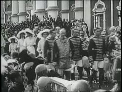 Czar Nicholas II walks in a procession with his family and Russian Orthodox Church clergy members. News Clip