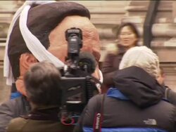 Small Anti-Murdoch Protest Outside Conference News Clip