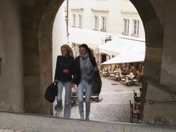 two women running up the stairs on a city street Stock Footage