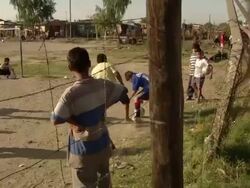 MS TS Shot of group of kids playing football on ground / Buenos Aires, Argentina Stock Footage