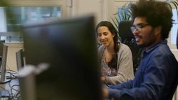 Business people communicating while using computers Stock Footage