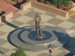 CU AERIAL ZO Shot of mans statue in Kannapolis city / North Carolina, United States Stock Footage