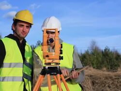 Land surveyors on construction site Stock Footage