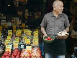 MS PAN Master of greengrocer is salesperson standing in front of shop / Toyooka, Hyogo, Japan Stock Footage