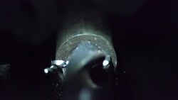 Slow motion of drill press drilling to metal. Stock Footage