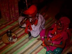MS Groom and bride sitting on the floor at their wedding ritual / Rajasthan, India Stock Footage