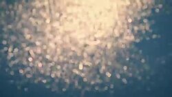 bokeh of sunset light reflect on wave at sea with vintage color effect (Blurred to focus background) Stock Footage