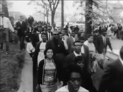 B/W 1963 crowd of marchers on sidewalk in civil rights demonstration / Alabama / newsreel Stock Footage
