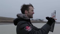 Young man taking photo of house with tablet in winter in rural Montana, USA. Stock Footage