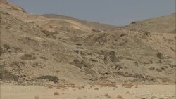 Desert mountains surround the ruinous entrance of a Sikait emerald mine in Egypt. Stock Footage