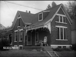 1952: WOMEN: VS Vera Schmidt sweeping porch outside house, kissing & saying goodbye to teenage son leaving house, Mrs. Schmidt entering house. Housewife Instructional Video