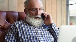 Adult Senior bearded man talking on a smartphone Stock Footage