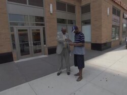 WS ZI worker from community business center handing out flyers to people passing from street AUDIO  / New York City, New York, United States Stock Footage