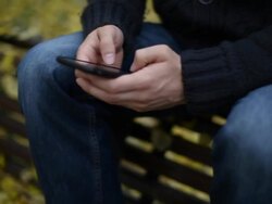 Man surfing the net on smartphone Stock Footage