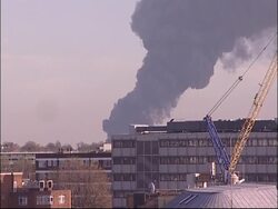 Thick plume of black smoke following fire in east London News Clip