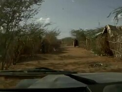 Riding through a village Stock Footage