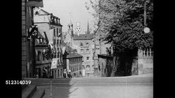 1934: SAAR PRO GERMANY: HD: VS Town buildings, businesses displaying Nazi swastika banners & signs, Saarland poster 'Wir wollen heim' (We want home), countdown calendar for January 13th 1935 plebiscite, VS Unidentified politicians.   Note: Film line Instructional Video
