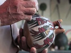 CU R/F Shot of man showing and drawing on pottery / South Of Peru, Nazca, Peru Stock Footage