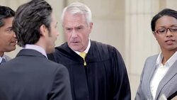 Judges and lawyers talking in courthouse Stock Footage