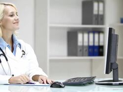 Young woman doctor examining X-ray image in doctor's office Stock Footage