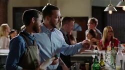 Manager oversees bartender and encourages him to treat customers with respect Stock Footage
