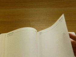 MS, Time lapse, Hand flicking trough pages of Diary Stock Footage