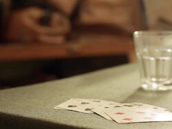 A card hand placed on the table the figures discovered Stock Footage
