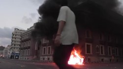 Clashes between pro and anti Morsi supporters; one man tries to escape by jumping into the sea News Clip