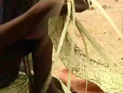 Woman braiding straw Stock Footage