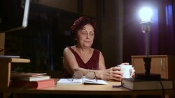 Grandmother reading a book Stock Footage
