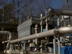 Medium tilt-down zoom-out - A gas recovery system recycles gases from landfills Stock Footage
