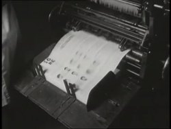 A printing press produces wanted posters. News Clip