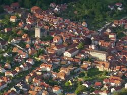 MS AERIAL Shot of houses and river marshland of Werra / Germany Stock Footage