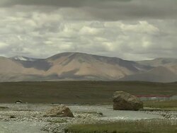 Pull Back From Mountain Revealing River Stock Footage