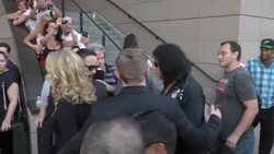 Gene Simmons & Shannon Tweed on red carpet at Mending Kids Music On A Mission at Lucky Strike in Hollywood Stock Footage