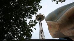 The Experience Music Project with the Space Needle next to it in downtown Seattle. Stock Footage