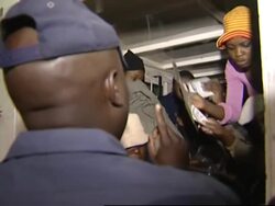 Raid on church where Zimbabweans sheltering News Clip