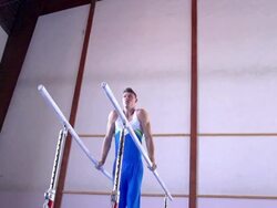 HD:Super Slo-Mo Shot of Gymnast Performance on Parallel Bars Stock Footage